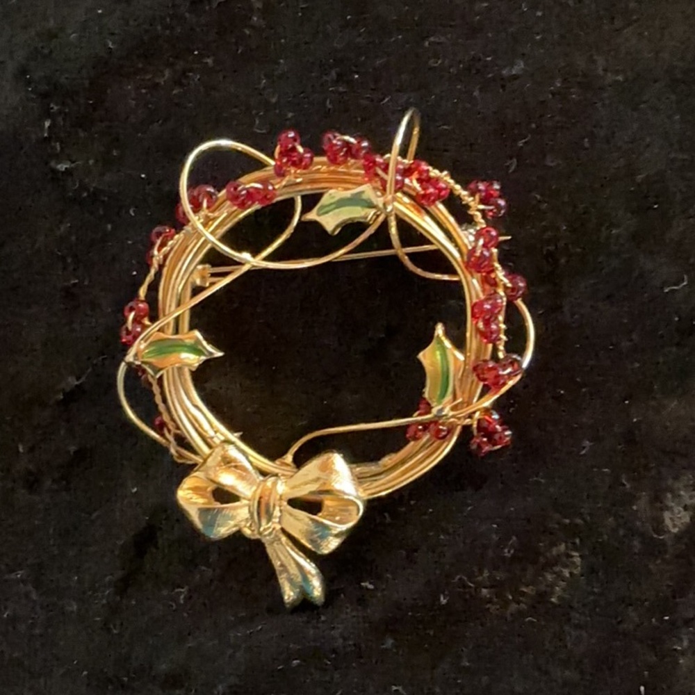 Elegant Gold and Red Wreath Brooch from Casual Corner